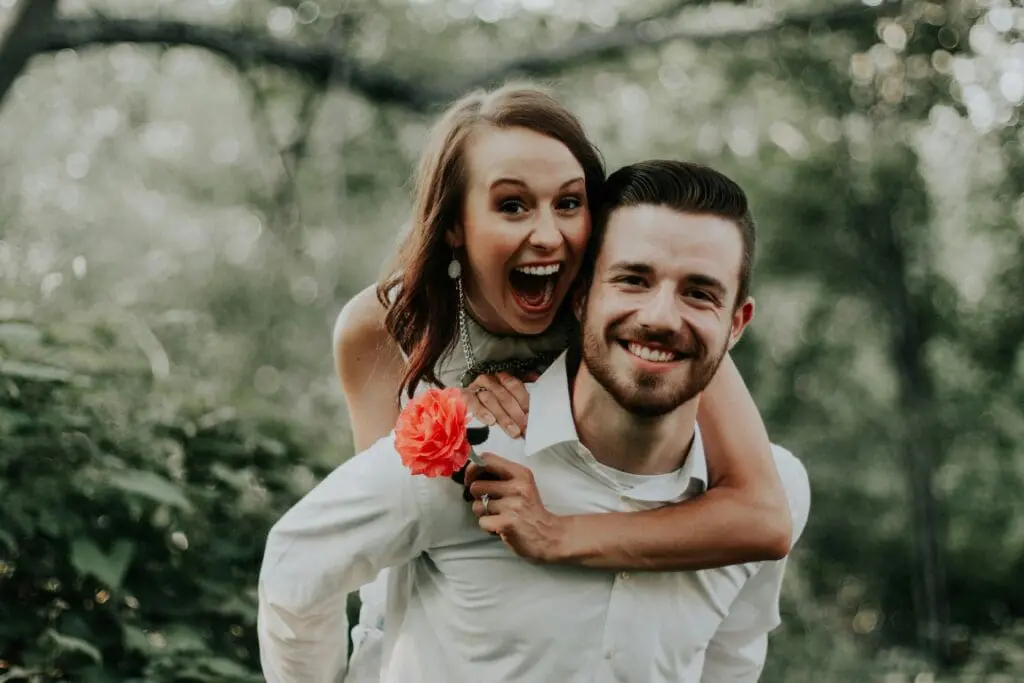 A joyful couple celebrating their wedding day, surrounded by loved ones and confetti