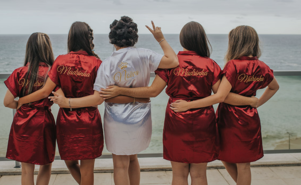 A group of bridesmaids sharing a heartfelt laugh together, capturing the essence of their close friendship. "alt tag: A candid moment of joy and laughter among bridesmaids, showcasing the depth of their bond