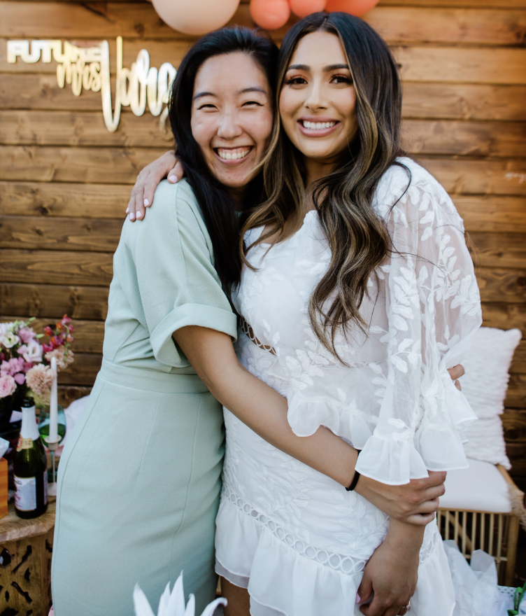 A heartwarming image of a maid of honor celebrating the bride on her special day.