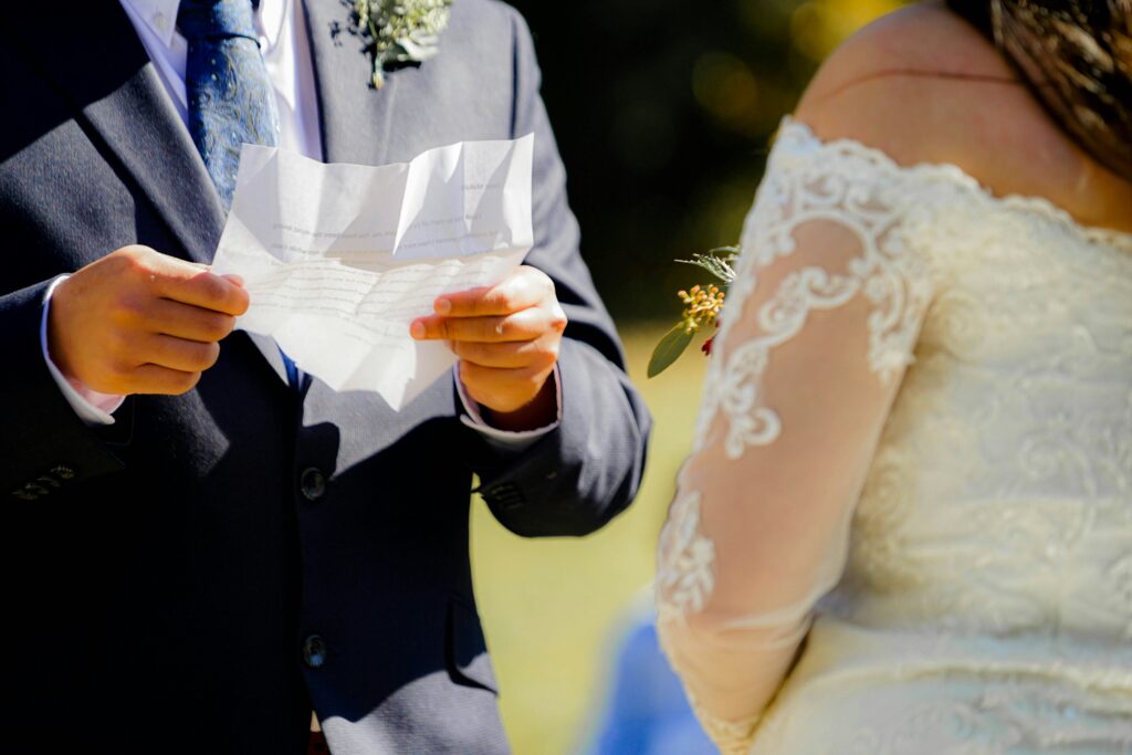 A couple exchanging rings during their wedding ceremony, symbolizing their commitment to each other.