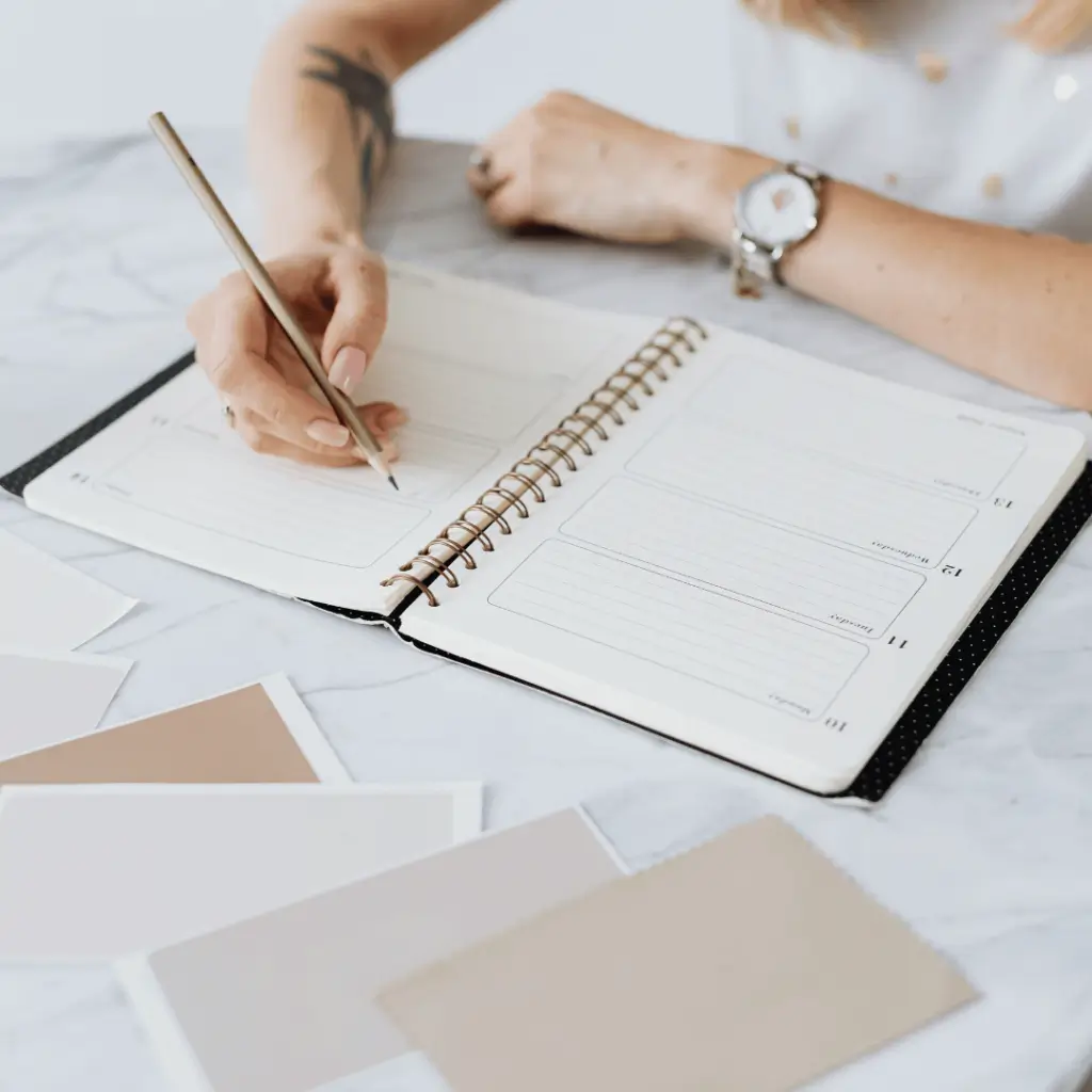 woman writing in her notebook