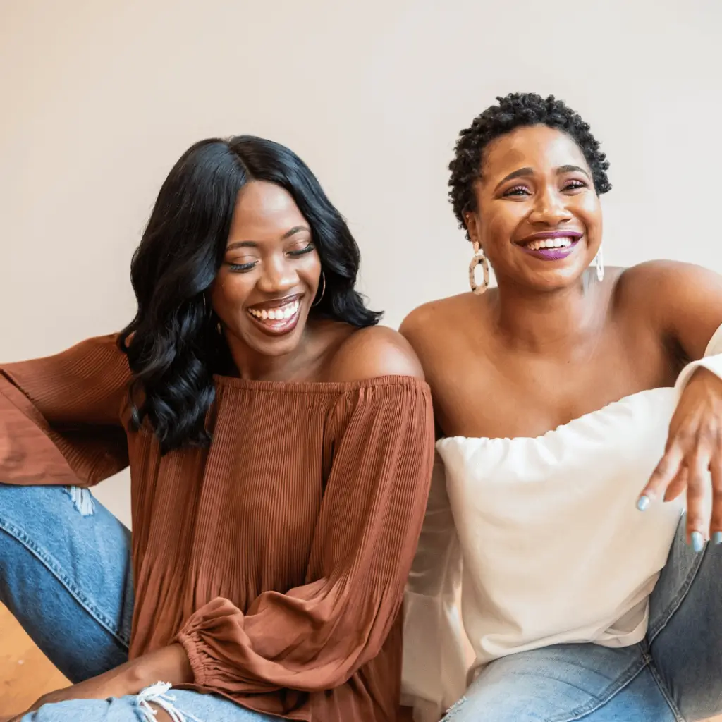 bride and her sister laughing