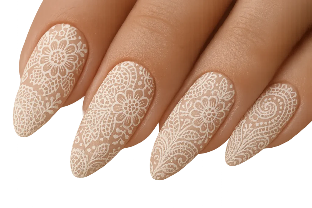Intricate vintage lace nail art on almond nails