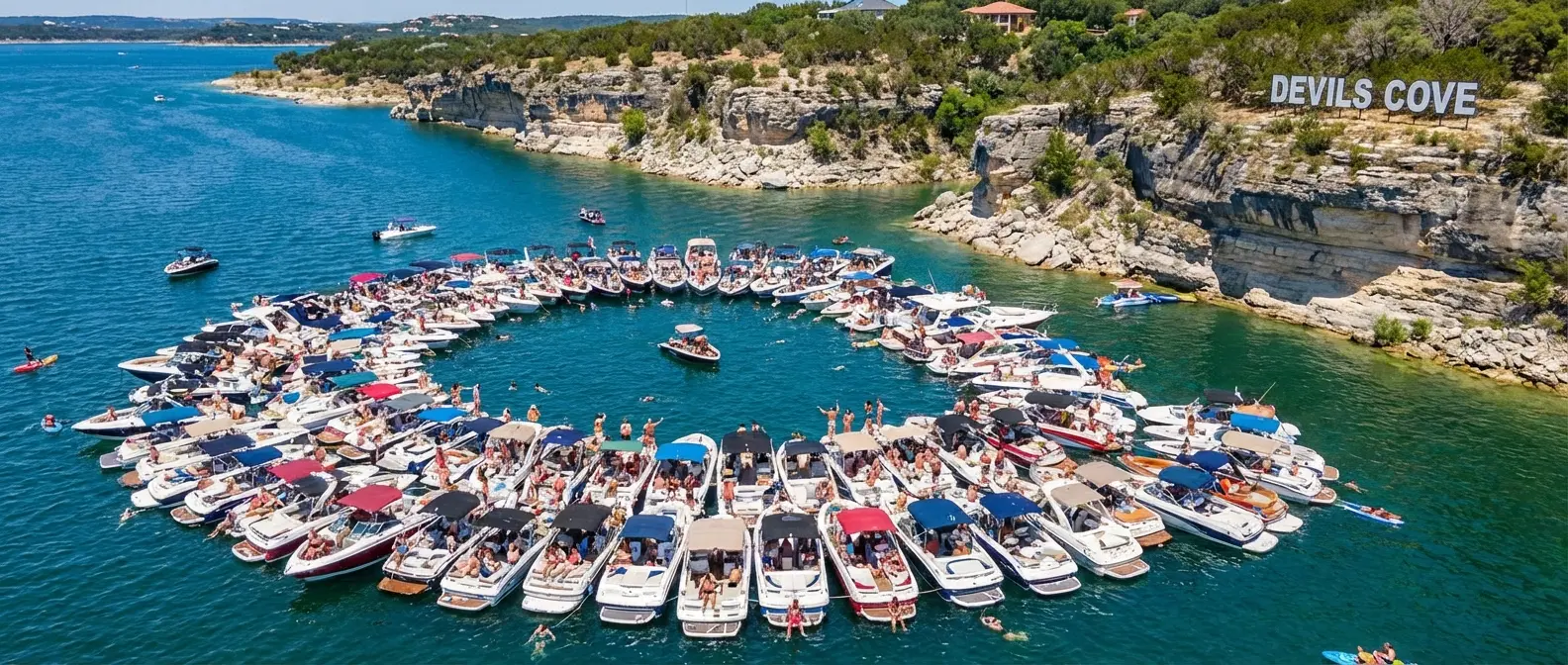 Party barges tied together at Devil's Cove on Lake Travis